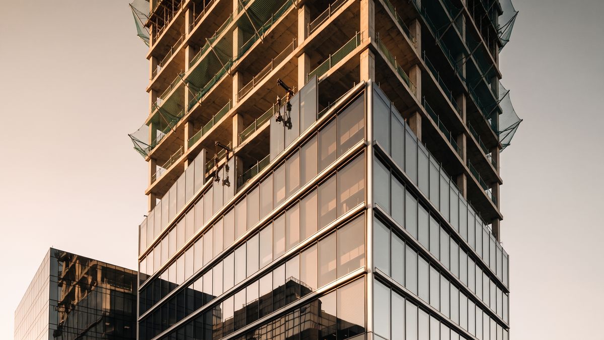 During: recladding in progress, upper floors